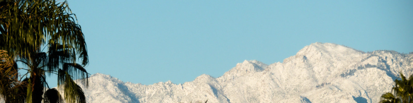 desert sunrise on snow covered mountains